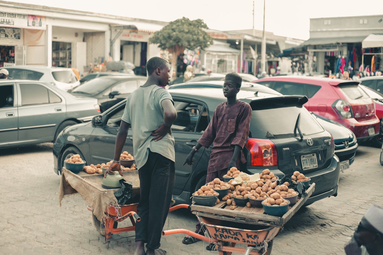 street-market-vendors-with-potato-carts-on-busy-road-33059920